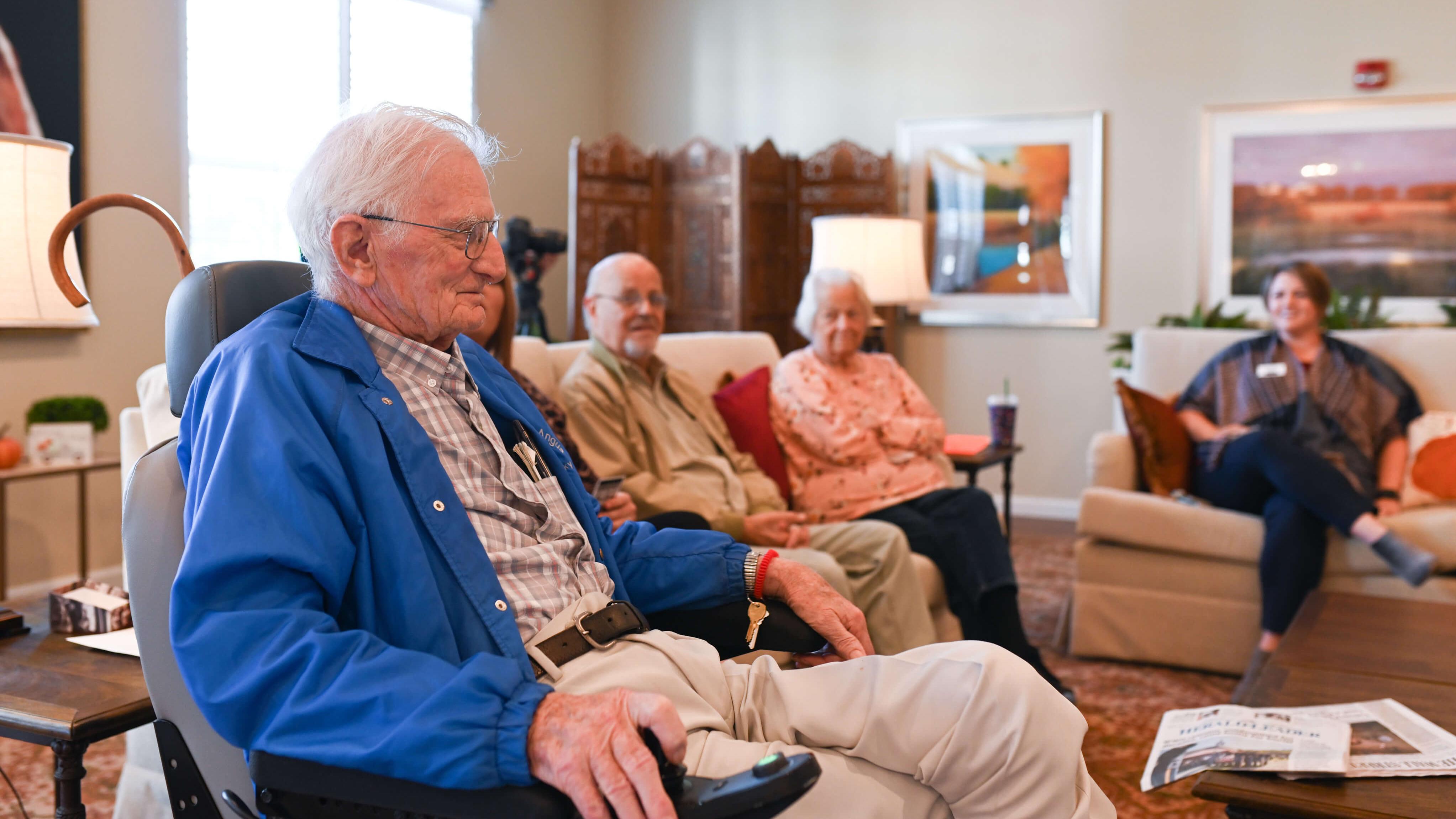 group of residents sitting in common area talking