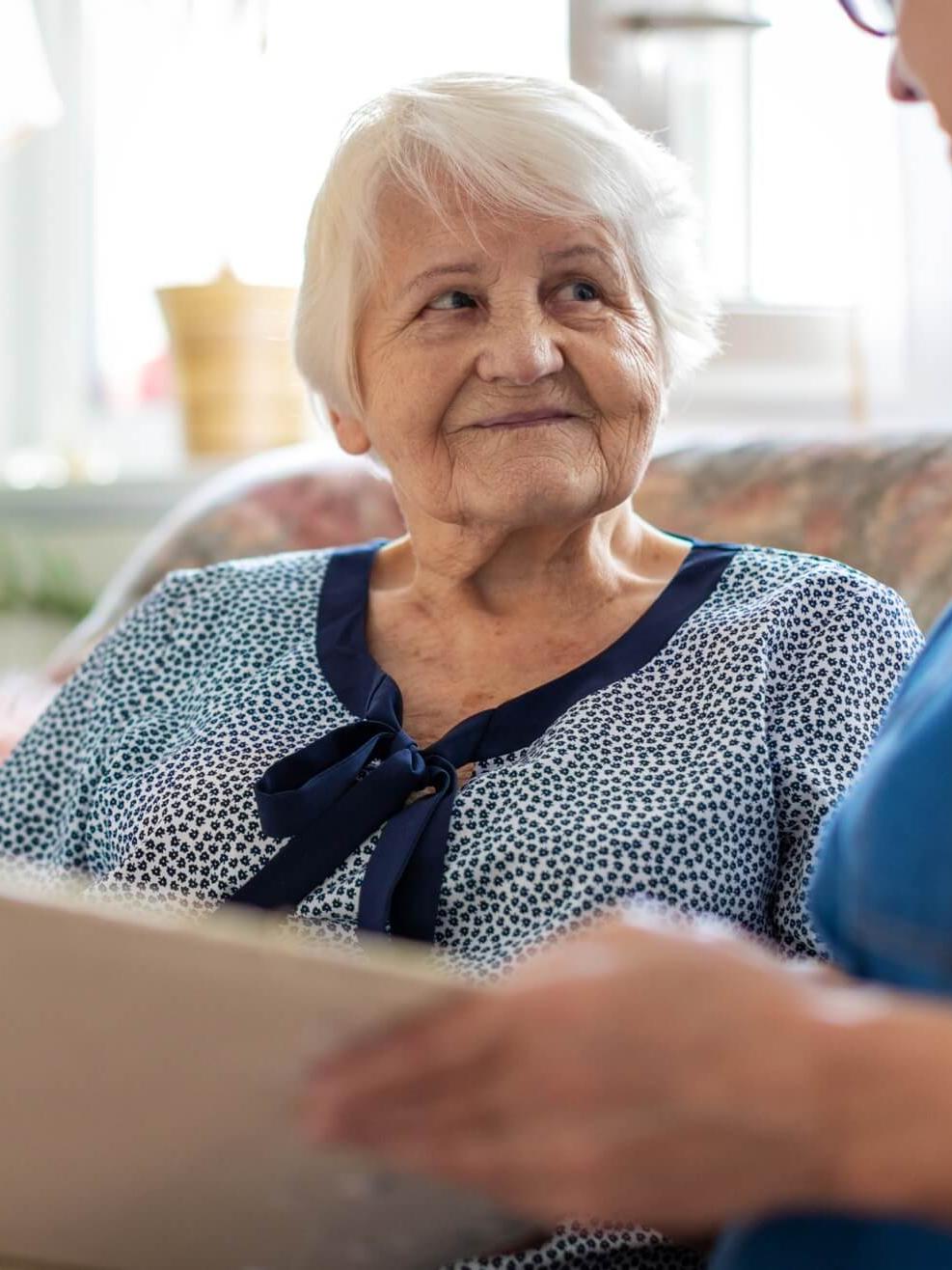 Memory Care patient sitting with caregiver