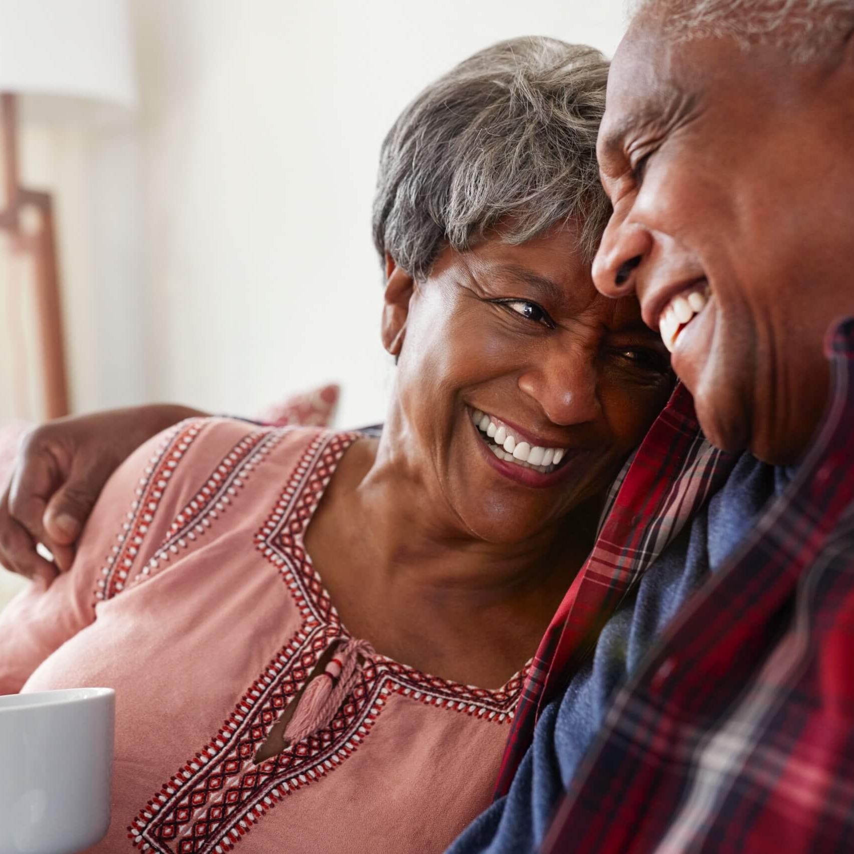 elderly couple enjoying a cup of coffee