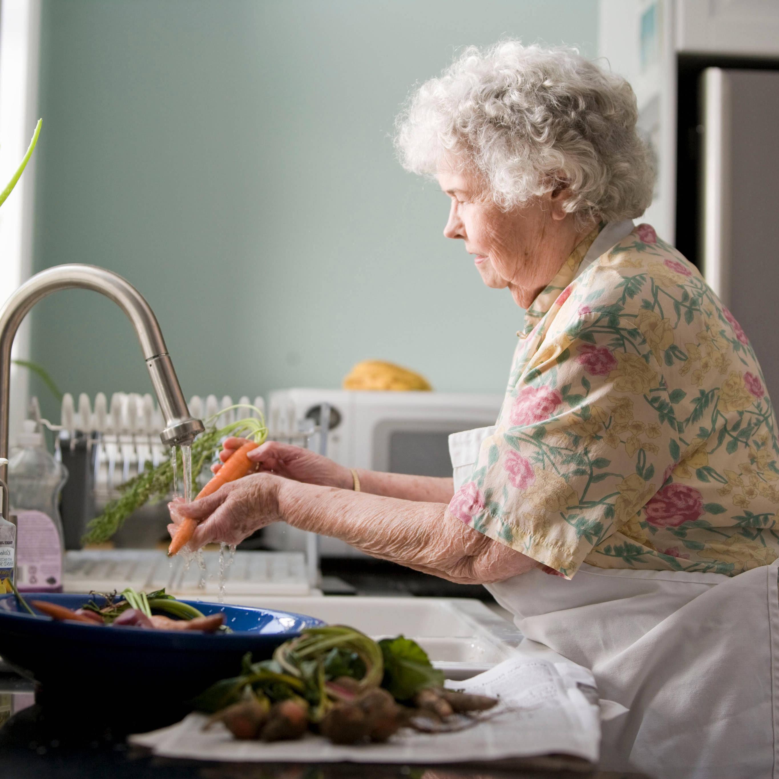 Woman cleaning veggies