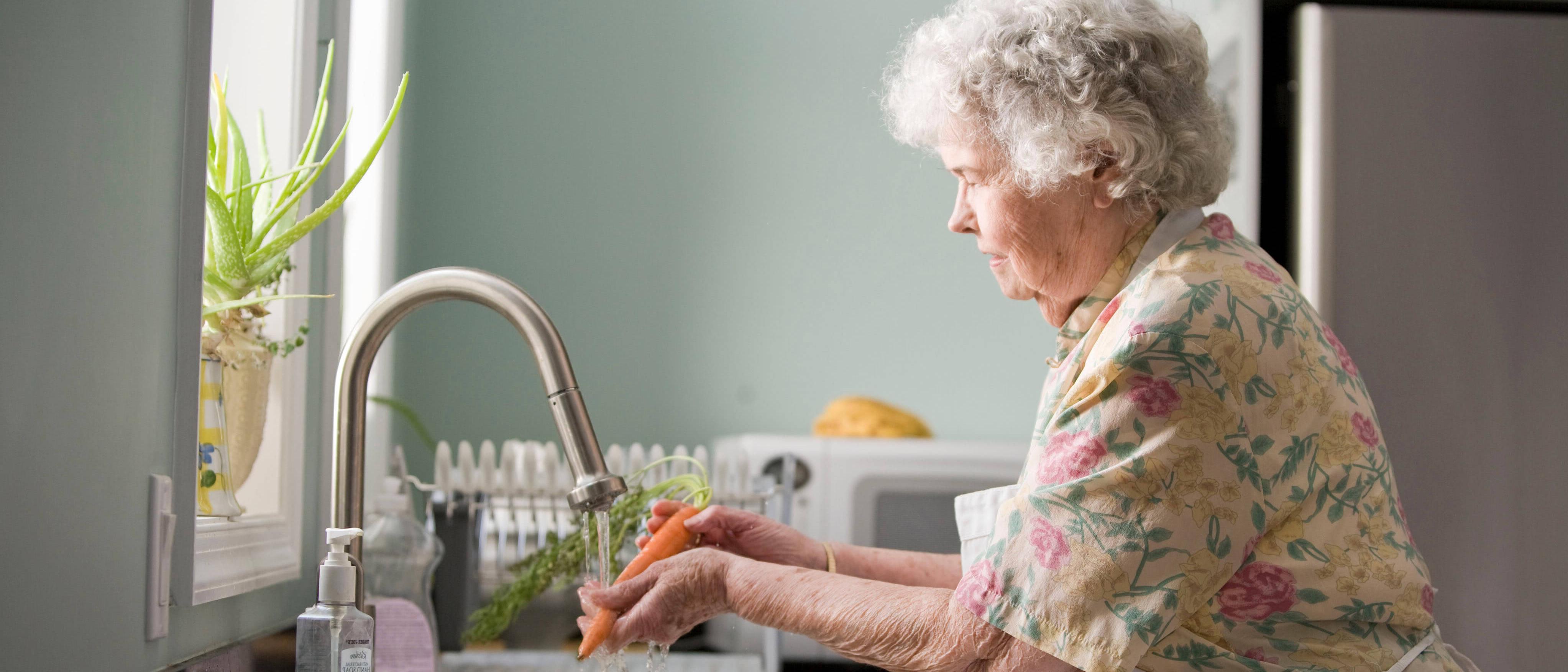 Woman cleaning veggies