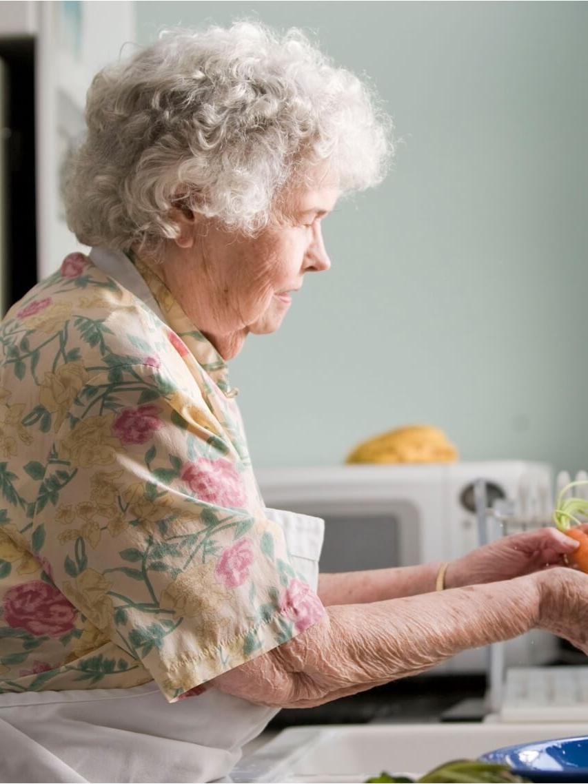 woman cleaning a carrot