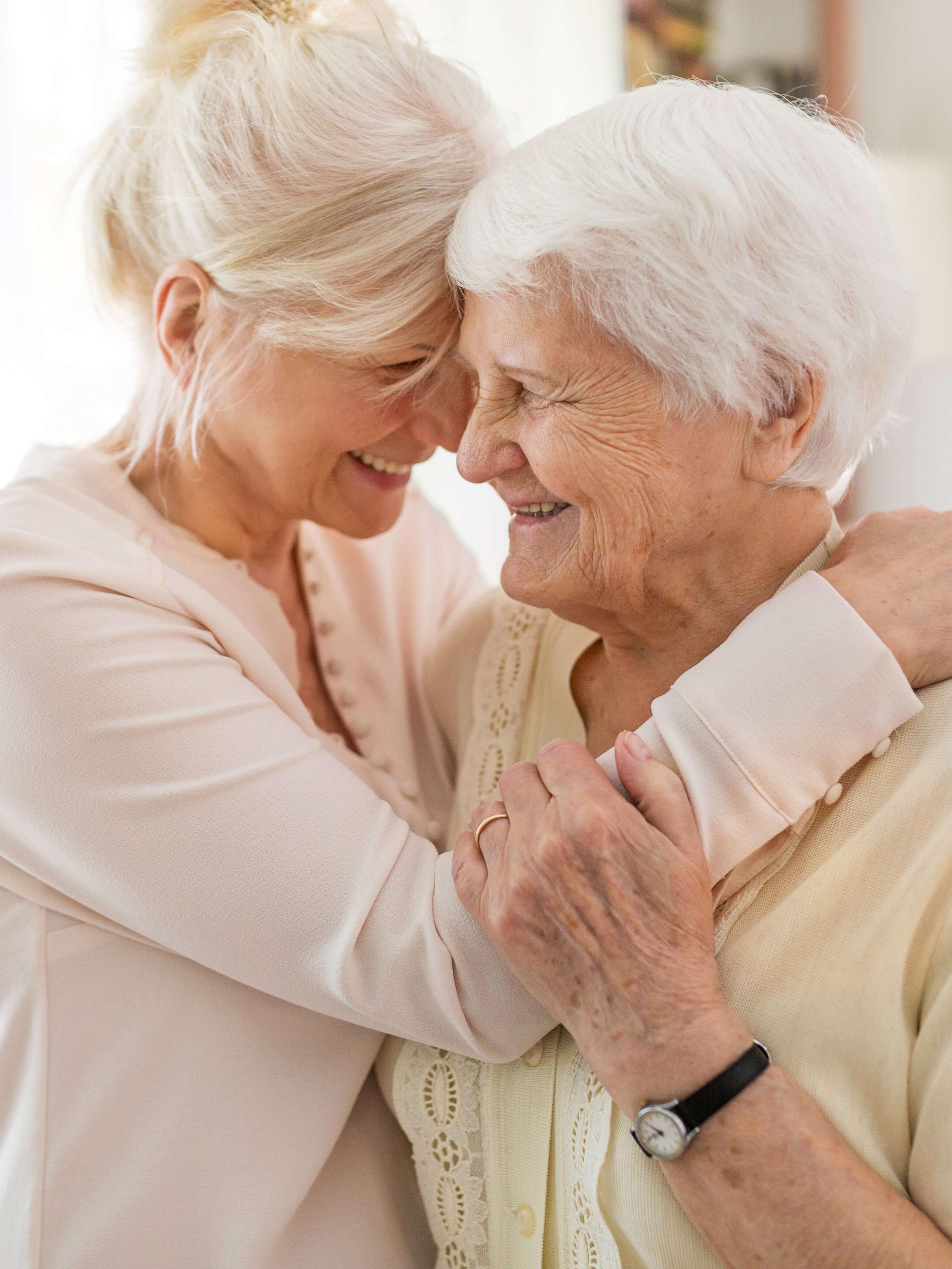 two women embracing each other