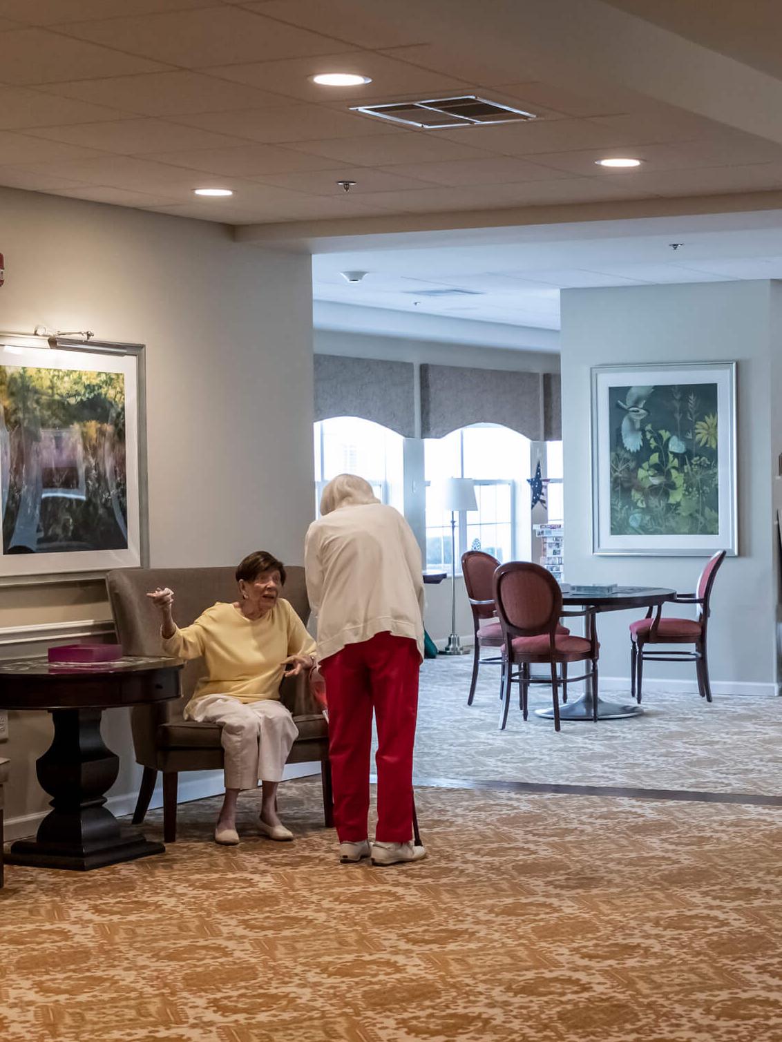 two women chatting in lobby of apple blossom