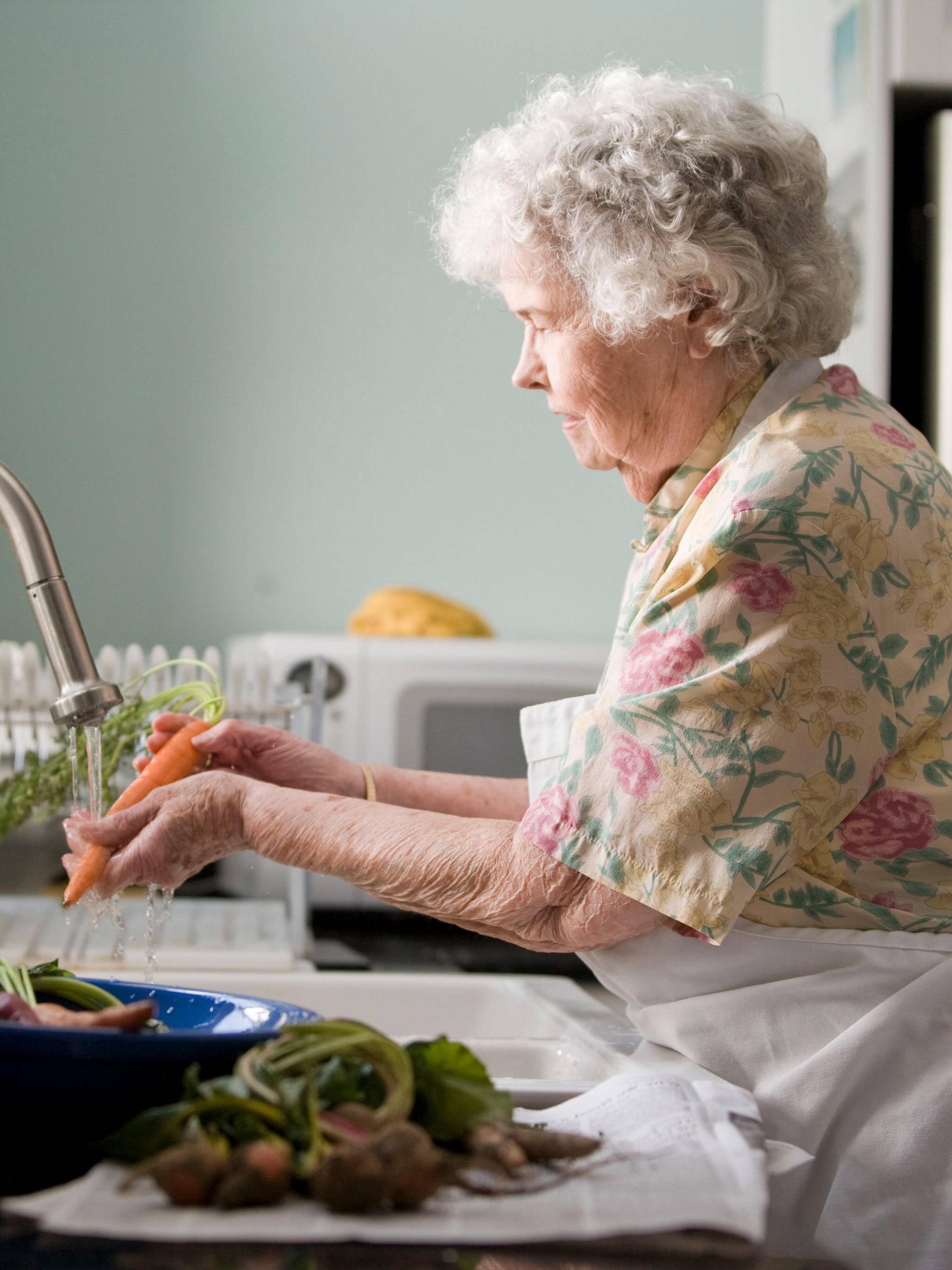 Woman cleaning veggies